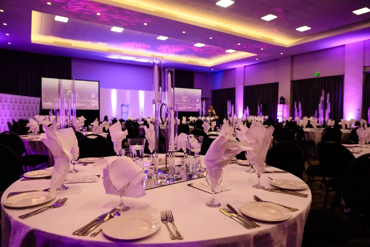 Purple-lit gala setting from the ESI portfolio on Mossel Bay Tourism